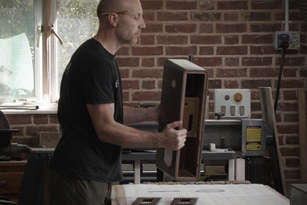 Craftsman working on R5 MiE cabinet